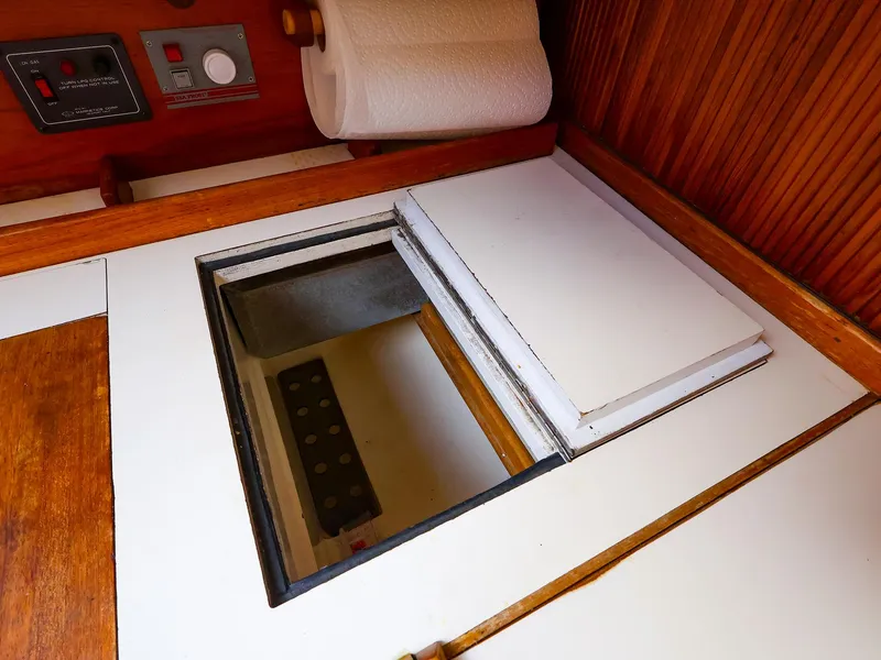 Slide: The Image of Interior view of 1987 Sabre 36 Sloop showing storage compartment and control panel. - 20