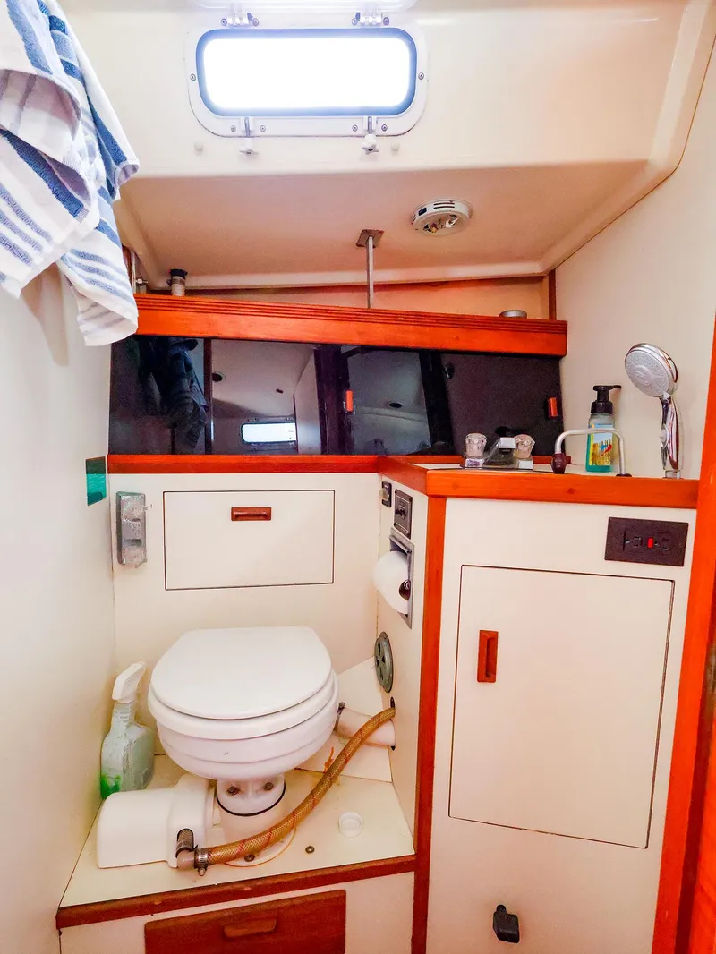 Slide: The Image of Interior of 1987 Sabre 36 Sloop bathroom with toilet and sink. - 33