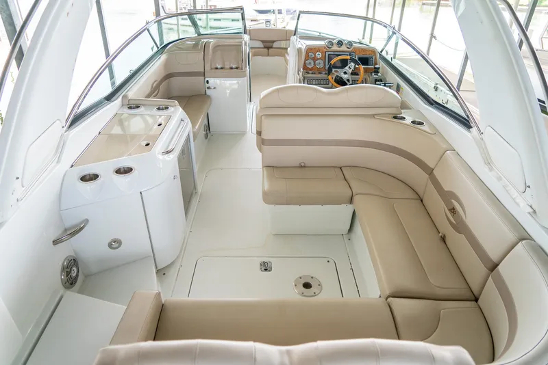 Slide: The Image of Luxurious interior of a 2012 Formula 310 Bowrider boat with beige seating and sleek design. - 10