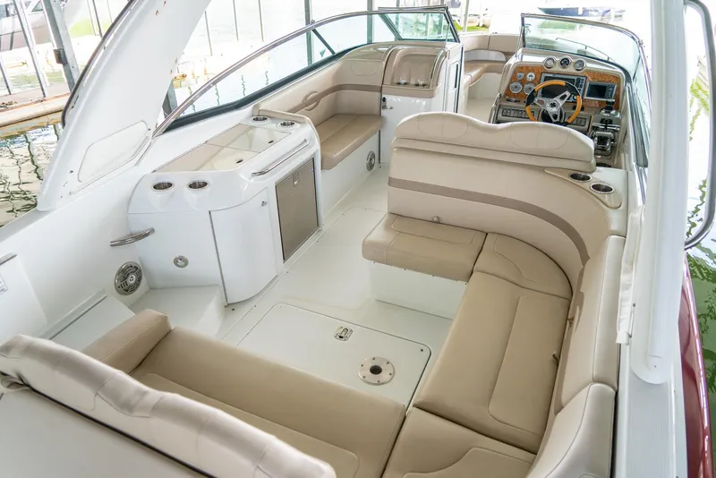 Slide: The Image of 2012 Formula 310 Bowrider interior with beige seating and modern dashboard. - 11