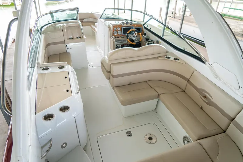 Slide: The Image of 2012 Formula 310 Bowrider interior with beige seating and modern dashboard. - 15