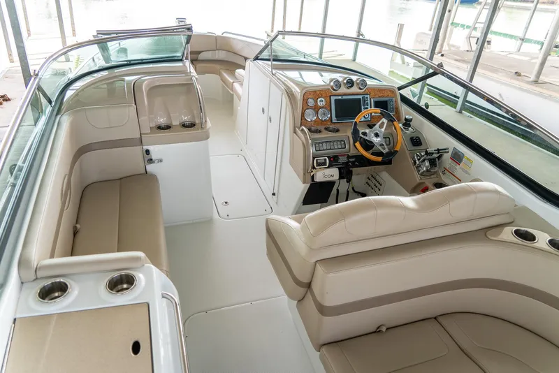 Slide: The Image of 2012 Formula 310 Bowrider interior with beige seating and modern dashboard controls. - 16