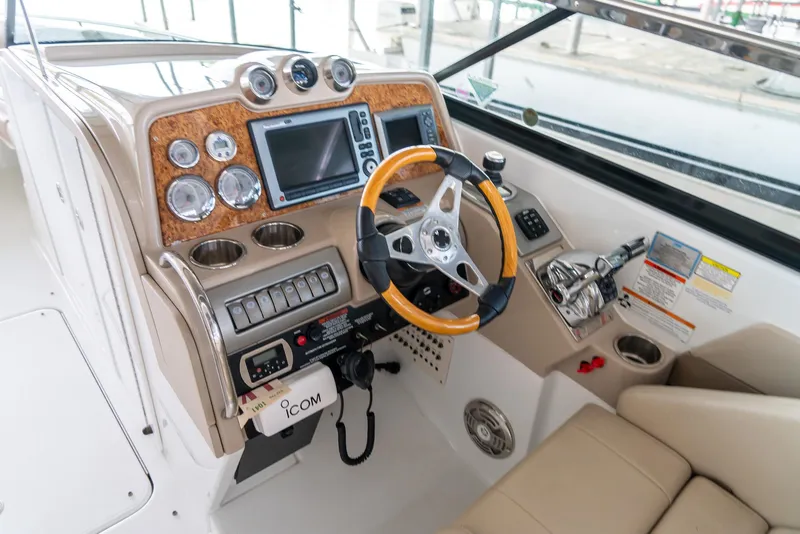 Slide: The Image of 2012 Formula 310 Bowrider dashboard with steering wheel and navigation controls. - 19