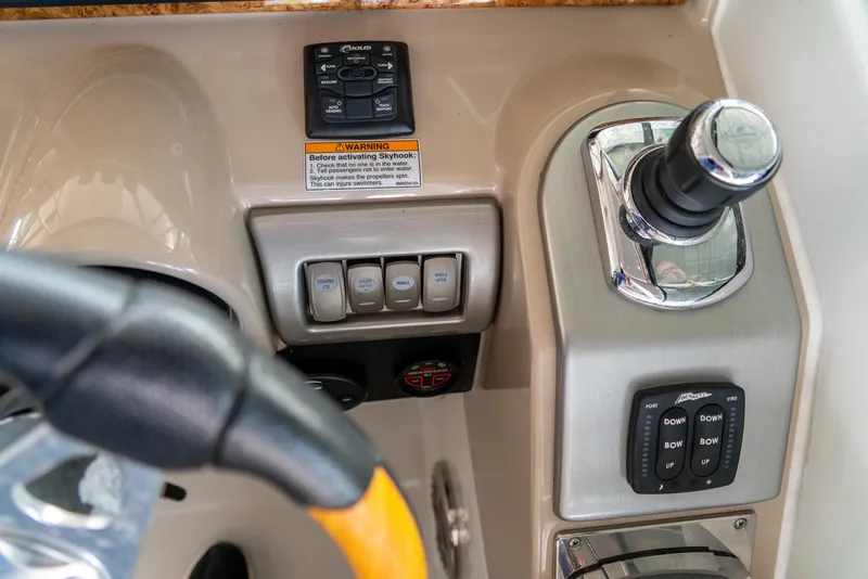 Slide: The Image of Control panel of a 2012 Formula 310 Bowrider boat with steering wheel and switches. - 21