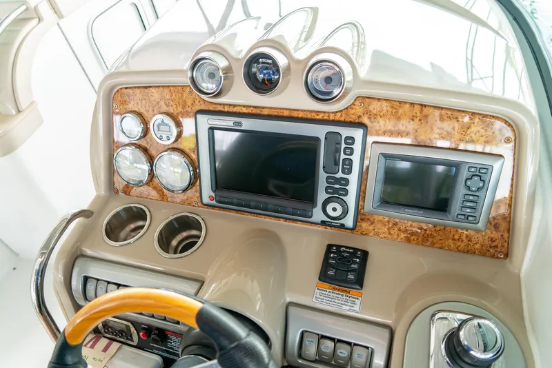 Slide: The Image of Dashboard of a 2012 Formula 310 Bowrider boat with navigation instruments and controls. - 23