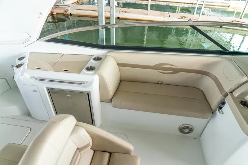 Slide: The Image of 2012 Formula 310 Bowrider interior with beige seating and built-in amenities. - 25