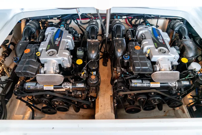 Slide: The Image of Twin engines in a 2012 Formula 310 Bowrider boat, showcasing powerful performance. - 34