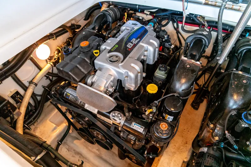 Slide: The Image of Engine compartment of a 2012 Formula 310 Bowrider, showcasing detailed mechanical components. - 35