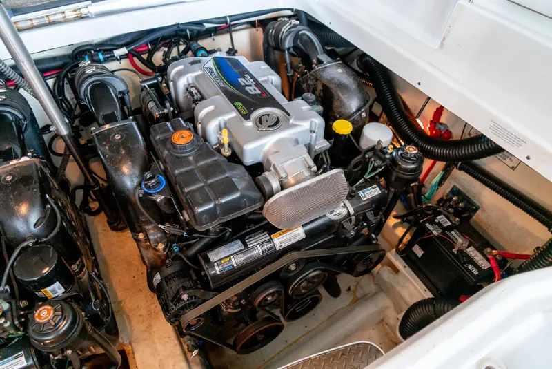 Slide: The Image of Engine compartment of a 2012 Formula 310 Bowrider, showcasing detailed mechanical components. - 36