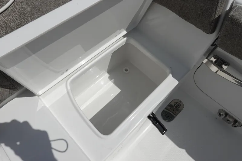Slide: The Image of Open storage compartment on 2026 Sea Hunt Ultra 265 SE boat. - 15