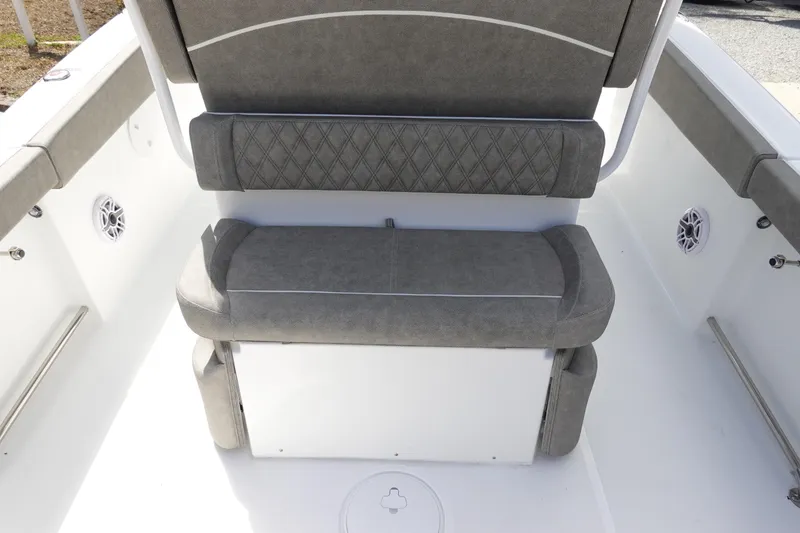 Slide: The Image of 2026 Sea Hunt Ultra 265 SE boat seating area with gray cushioned seats. - 16