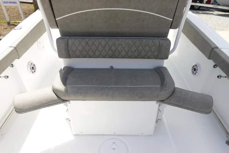 Slide: The Image of 2026 Sea Hunt Ultra 265 SE boat seating area with gray upholstery. - 17