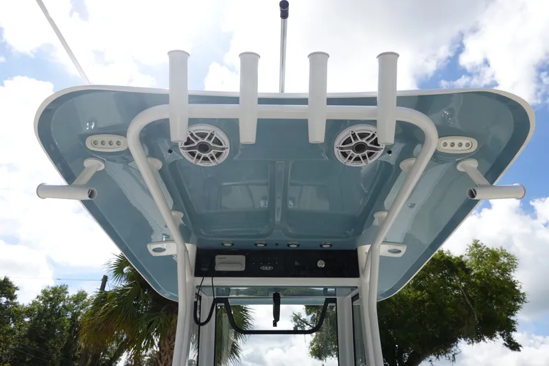 Slide: The Image of 2026 Sea Hunt Ultra 265 SE boat top view with rod holders and speakers. - 19