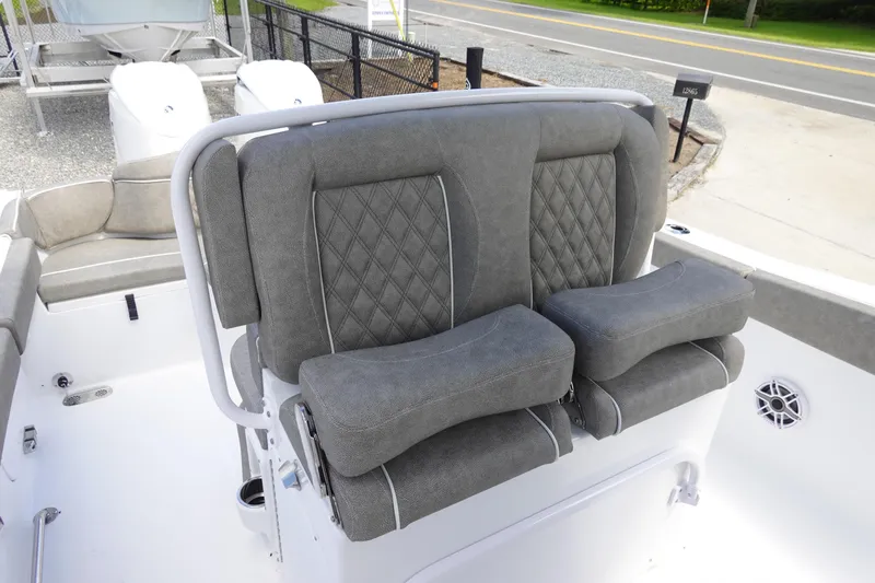 Slide: The Image of 2026 Sea Hunt Ultra 265 SE boat with plush gray seating and diamond stitching. - 20