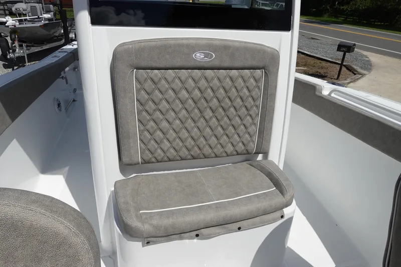 Slide: The Image of 2026 Sea Hunt Ultra 265 SE boat seat with diamond-patterned upholstery. - 31