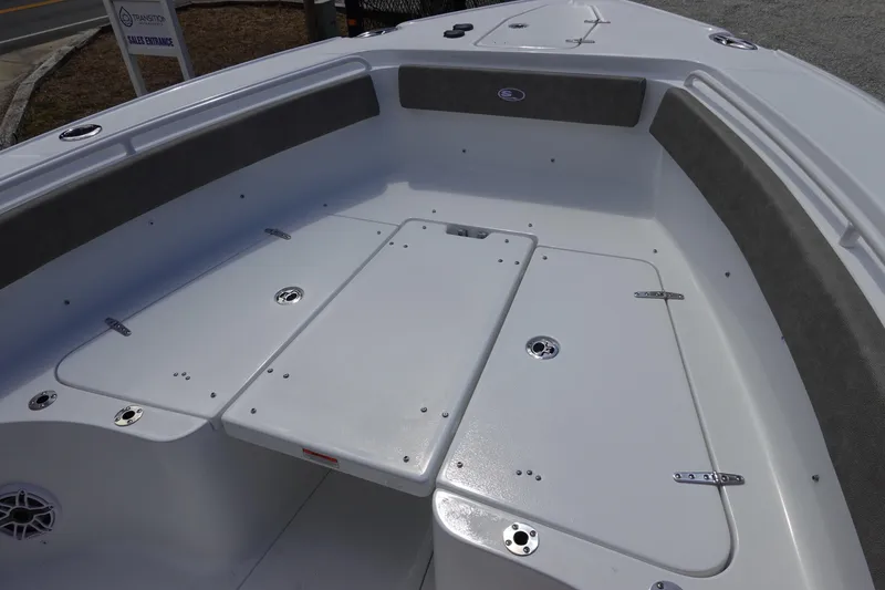 Slide: The Image of 2026 Sea Hunt Ultra 265 SE boat interior with cushioned seating and storage compartments. - 35