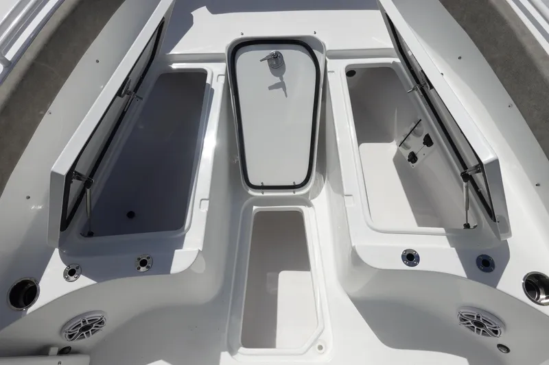 Slide: The Image of 2026 Sea Hunt Ultra 265 SE boat storage compartments and seating area. - 37