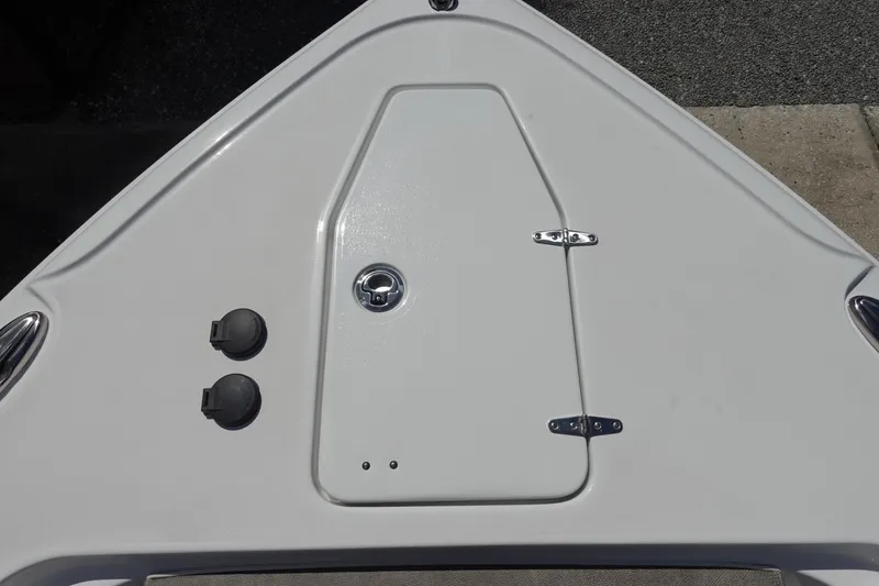 Slide: The Image of 2026 Sea Hunt Ultra 265 SE boat deck with storage hatch and fittings. - 38