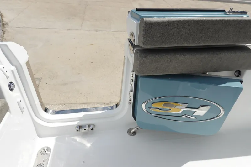 Slide: The Image of 2026 Sea Hunt Ultra 265 SE boat interior with SH logo and seating detail. - 45