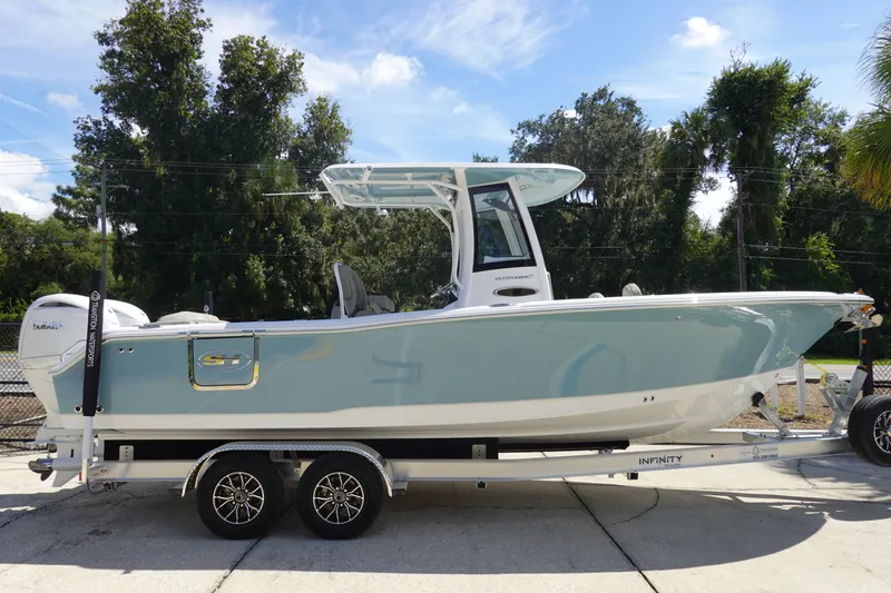 Slide: The Image of 2026 Sea Hunt Ultra 265 SE boat on trailer, side view, outdoors. - 6
