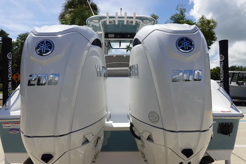 Slide: The Image of 2026 Sea Hunt Ultra 265 SE with dual Yamaha 200 engines, rear view. - 8