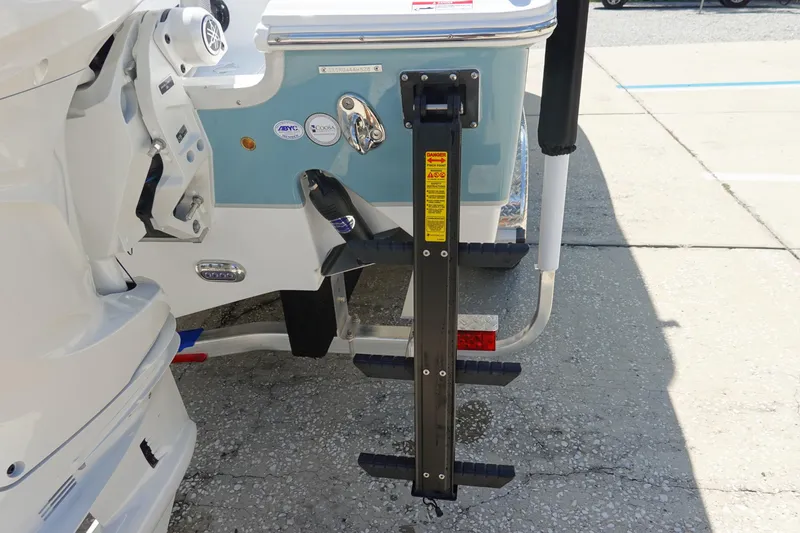 Slide: The Image of 2026 Sea Hunt Ultra 265 SE boat with a foldable boarding ladder. - 9