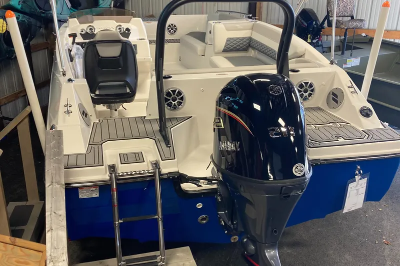 Slide: The Image of 2025 Starcraft SVX 171 OB boat with outboard motor in a showroom. - 3