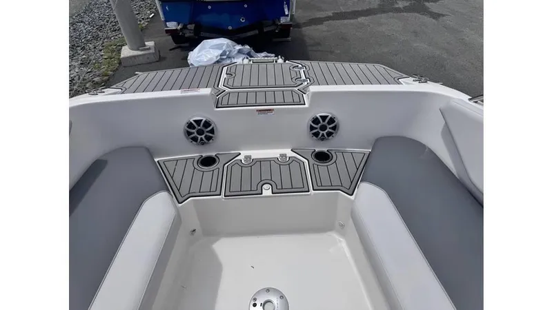 Slide: The Image of 2025 Starcraft SVX 171 OB boat interior with gray seating and cup holders. - 7