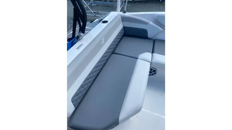 Slide: The Image of 2025 Starcraft SVX 171 OB boat interior with gray cushioned seating and quilted accents. - 8