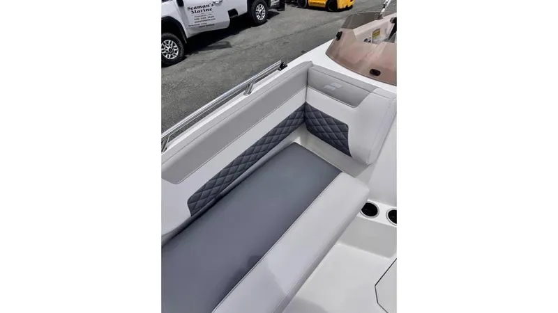 Slide: The Image of 2025 Starcraft SVX 171 OB boat interior with gray and white seating. - 9