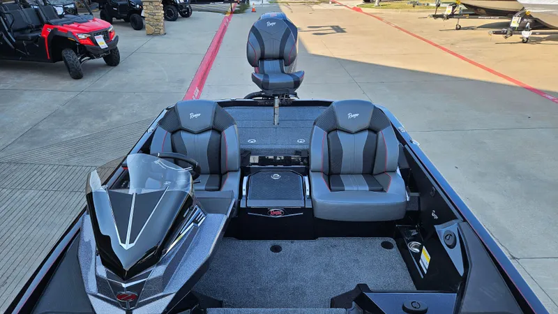 Slide: The Image of 2025 Ranger Z520 boat interior with sleek seating and modern design. - 2