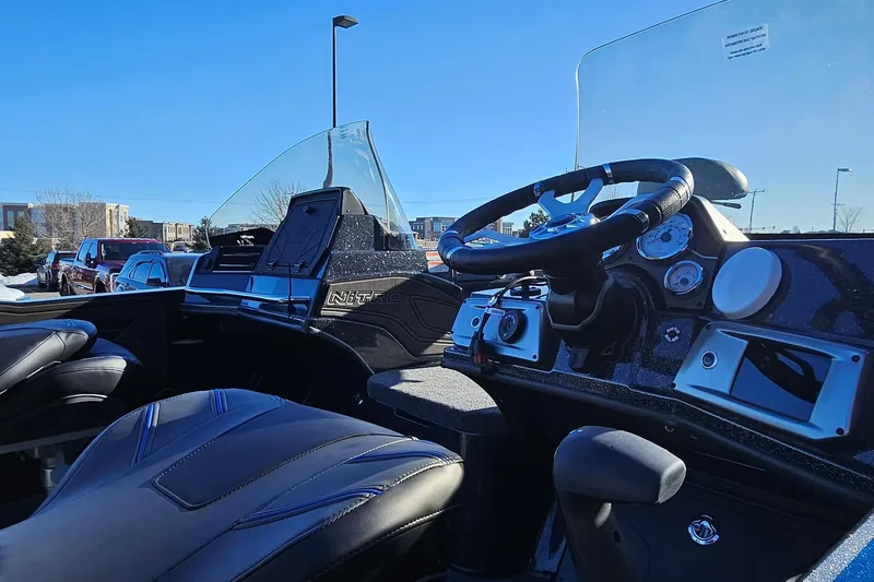 Slide: The Image of Interior view of 2025 Nitro ZV20 boat cockpit with steering wheel and dashboard. - 8