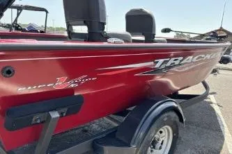 Slide: The Image of 2025 Tracker Super Guide V-16 T boat in vibrant red on a trailer. - 3