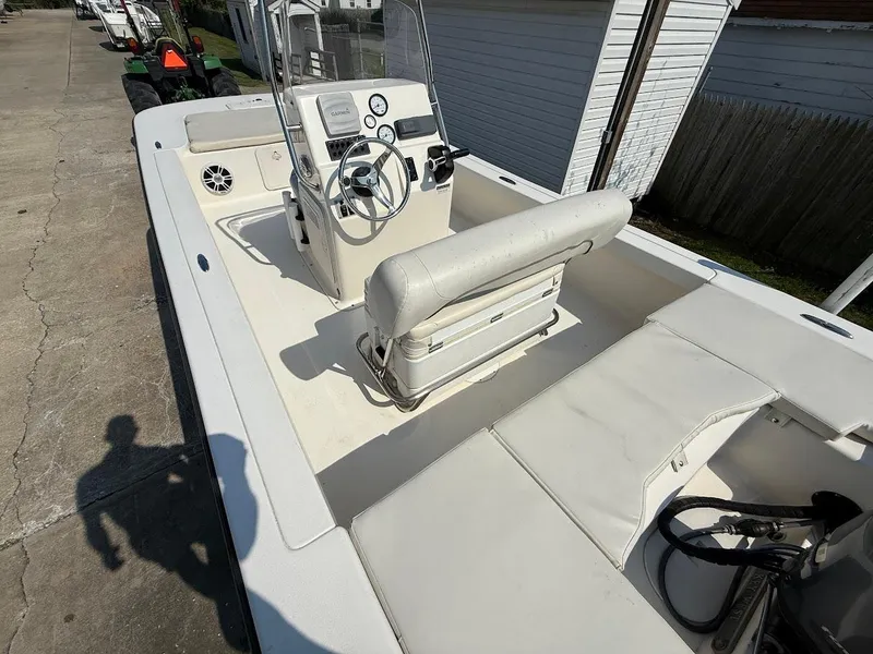 Slide: The Image of 2015 Key West 177 Skiff boat interior with steering console and seating. - 6