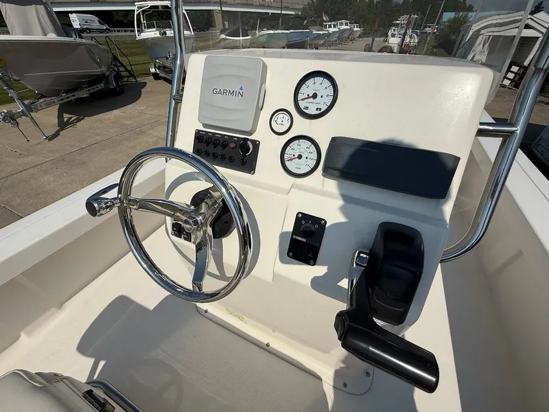 Slide: The Image of 2015 Key West 177 Skiff boat console with Garmin navigation and steering wheel. - 7