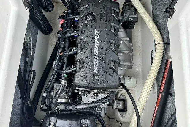 Slide: The Image of 2014 Yamaha Boats SX190 engine compartment with high output engine components. - 21