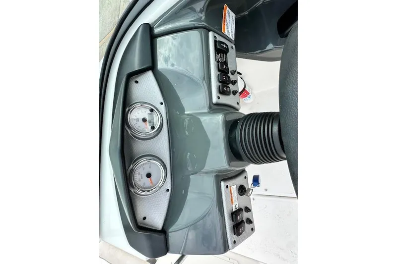 Slide: The Image of Dashboard of a 2014 Yamaha SX190 boat with instruments. - 22