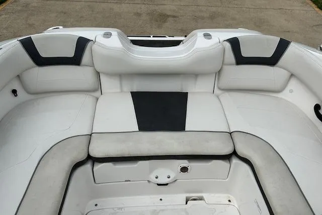 Slide: The Image of 2014 Yamaha Boats SX190 interior seating with white and black upholstery. - 23