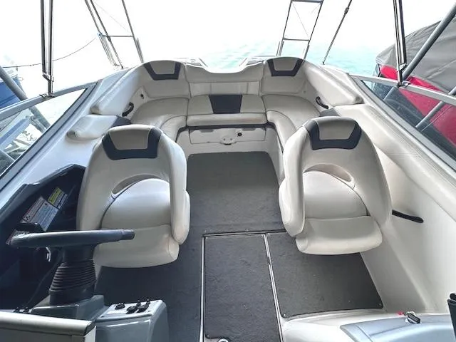 Slide: The Image of 2014 Yamaha Boats SX190 interior with white seating and steering console. - 8