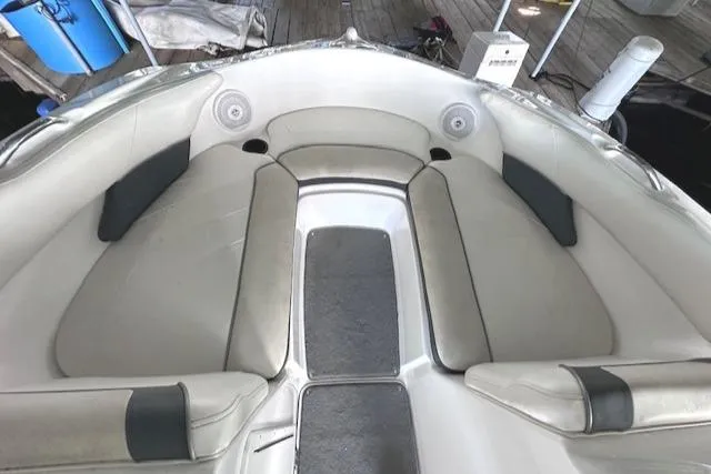 Slide: The Image of 2014 Yamaha Boats SX190 interior seating with gray upholstery and spacious layout. - 9