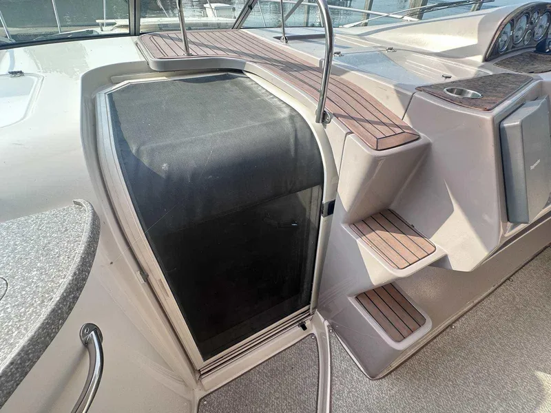 Slide: The Image of 2004 Rinker Fiesta Vee 410 boat interior with steps and cockpit door. - 15