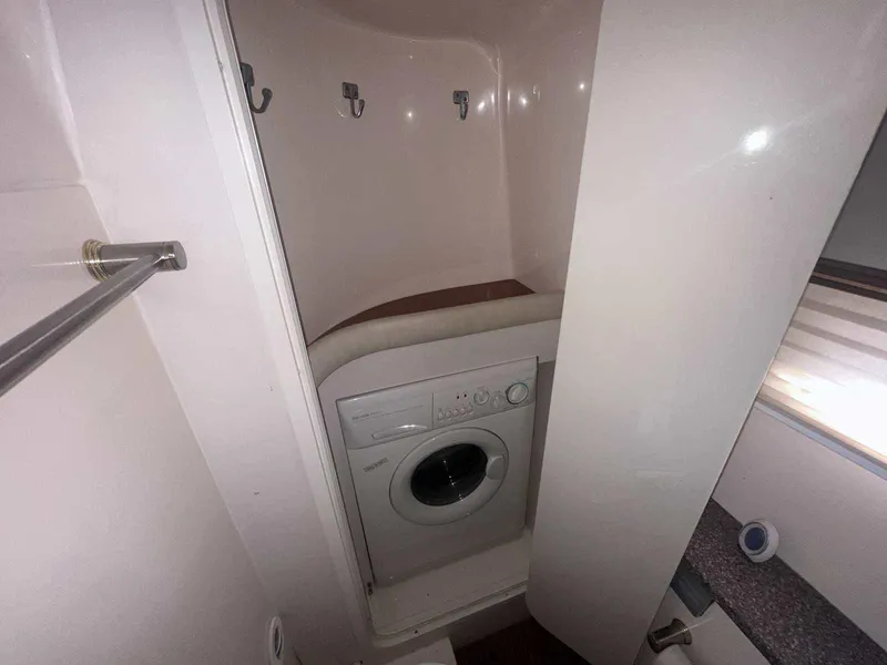 Slide: The Image of Compact laundry area in 2004 Rinker Fiesta Vee 410 boat bathroom. - 25