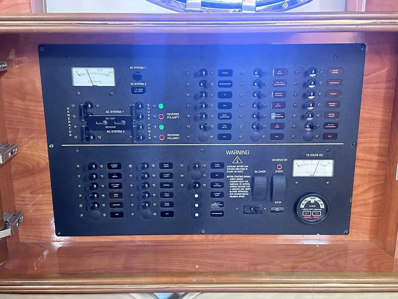 Slide: The Image of Electrical control panel on a 2004 Rinker Fiesta Vee 410 boat. - 26