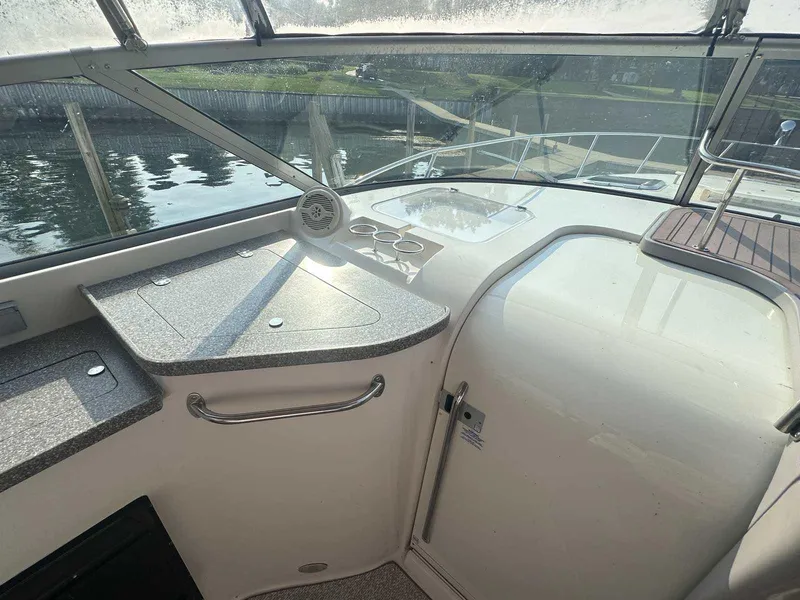 Slide: The Image of 2004 Rinker Fiesta Vee 410 boat interior with countertop and window view. - 6