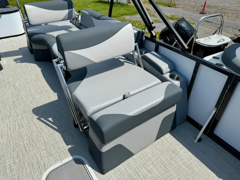 Slide: The Image of 2025 Avalon LSZ Quad Lounger Shift boat interior with modern seating and cup holders. - 6