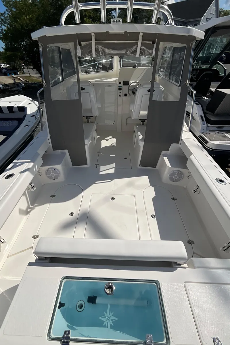 Slide: The Image of 2026 NorthCoast 255 HT boat interior, featuring spacious seating and modern design. - 4