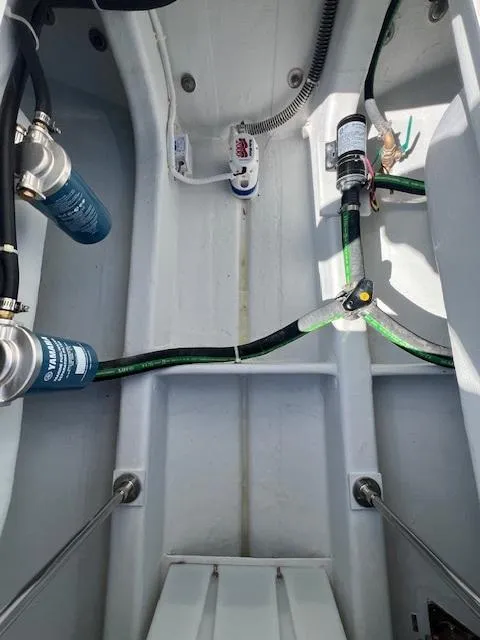 Slide: The Image of Interior view of 2026 NorthCoast 255 HT boat showing plumbing and wiring components. - 7
