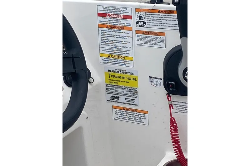 Slide: The Image of 2025 Bayliner Element M17 dashboard with safety warnings and capacity details. - 11