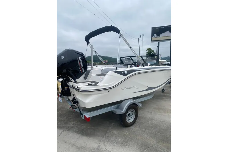 Slide: The Image of 2025 Bayliner Element M17 boat on trailer, featuring Mercury outboard motor. - 5