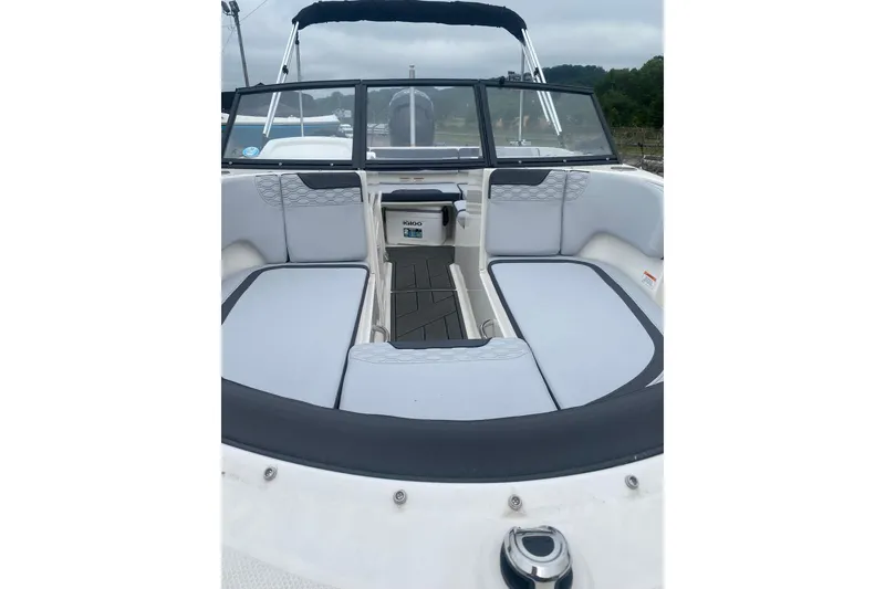 Slide: The Image of 2025 Bayliner Element M17 boat interior with cushioned seating and windshield. - 6